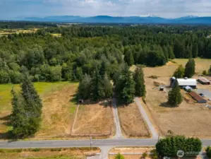 Looking down on the 5+ acre farm with Mt Baker in the background.