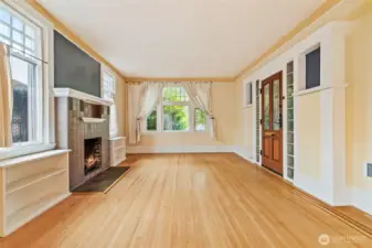 Elegant open-concept flow with ribbon inlaid hardwood floors and abundant natural light.