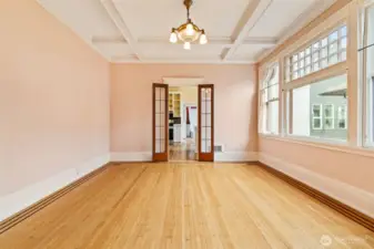 French doors lead to a refreshed kitchen, blending old-world elegance with modern updates.