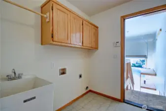 Indoor laundry room off of garage