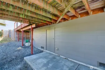 Door to storage area/basement (under deck)