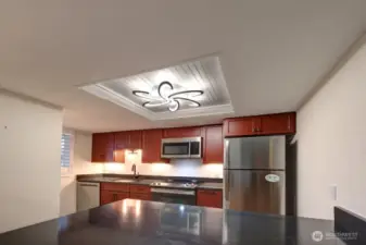 Completely remodeled kitchen with new lighting, flooring, cabinets, counter tops, appliances, fixtures and paint.