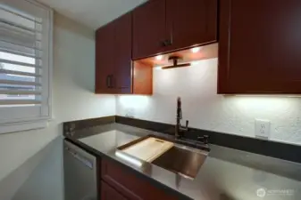 Completely remodeled kitchen with new lighting, flooring, cabinets, counter tops, appliances, fixtures and paint.