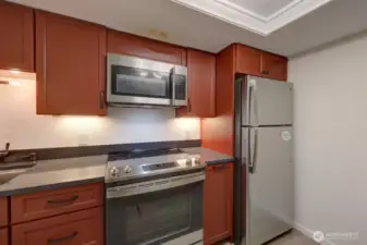 Completely remodeled kitchen with new lighting, flooring, cabinets, counter tops, appliances, fixtures and paint.