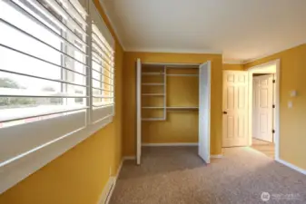 Bedroom #2 with large closet and closet systems already installed. Also new paint and carpet