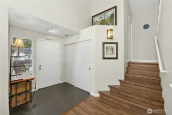 Entry with stairs to bedrooms on the right.