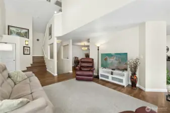 Living room from the sliding door to the deck.  Stairs to bedrooms and down the stairs to the garage. Entry is to the left.