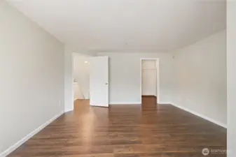 Primary Bedroom from the Windows. On right is large walk-in-closet.