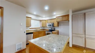 Dining area with pantry for storage.