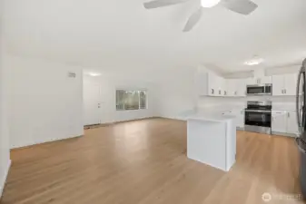 Open concept living with Quartz countertops, plenty of  space for cooking,   dining, entertaining or socializing"