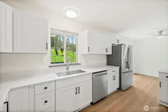 "All new Stainless Steel appliances and deep sink with great view to the back yard"