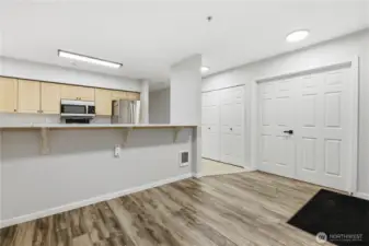 Guest bedroom through the double doors with laundry right off the kitchen.