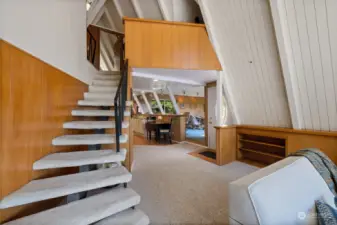 Stairs to the cool loft space, bedrooms & 1/2 bath.