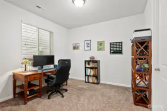 This den/office could be a great main floor bedroom as has a huge walk in closet it just needs double doors to close it off.