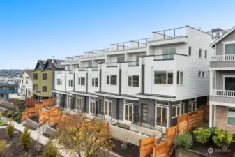 Welcome to Portside, where contemporary design meets timeless charm! These west-facing homes are bathed in sunlight, with beautiful water views and natural privacy from the main street. A perfect escape in the heart of North Queen Anne awaits you.