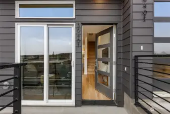 Step into elegance! The front entry showcases sleek modern architecture and dual-entry access for convenience.