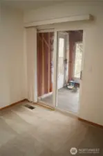 Door to enclosed porch off living room