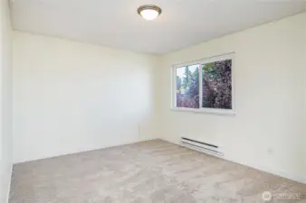 Generously sized second bedroom upstairs.