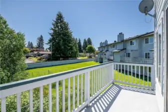 East facing balcony overlooking green space.