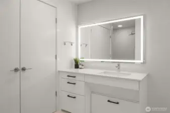 Bathroom features an in-unit Miele washer and dryer