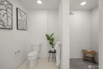 Bathroom features an ADA compliant ceramic tile shower