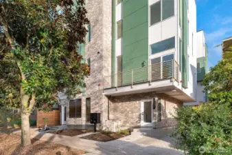 Welcome to The Olive Collection by Greencity Homes! This modern entryway invites you into a home designed with thoughtful details, nestled on a serene residential street yet steps away from Capitol Hill’s vibrant lifestyle.