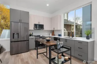This kitchen is a showstopper! With its modern two-tone cabinetry, sleek stainless steel appliances, and generous natural light pouring in, it’s the heart of this home.