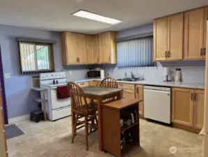 Large kitchen with refreshed maple cabinets. vertical blinds are though out the house. All appliances stay with the house.
