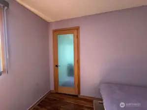 This door from the 2nd bedroom leads to the laundry room and wait for the surprise.
