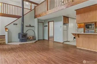 Cozy wood stove--kitchen on the right