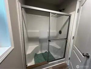 Both showers in the home have benches.