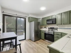 Kitchen with lots of natural light and some newer appliances