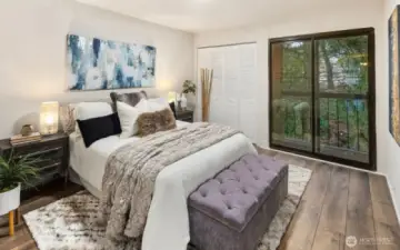 Large Bedroom with private balcony overlooking the yard