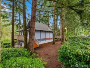 Clubhouse surrounded by mature trees. Forest like setting
