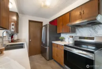 Well laid out kitchen With stainless appliances