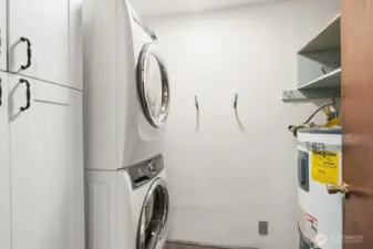 large laundry center with extra storage and pantry