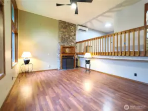 Soaring ceilings in Living room with cozy fireplace.
