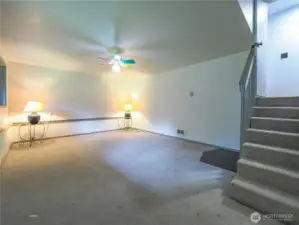 Daylight basement area multi purpose room large enough for hobbies or guests.