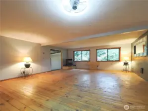 Oversized rec room, pellet stove and entry to 2 more lower level workout rooms.