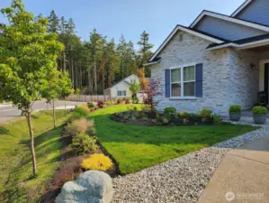 Owners have landscaped the whole parcel both back and front