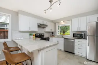 Upgrades include quartz counters, new flooring, soft close drawers & cabinets and new appliances.