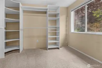 Built-in shelving in the walk-in. Actually has a window overlooking the backyard that makes it more like another small room.