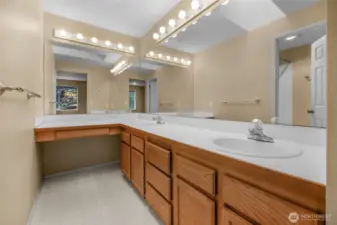 Dueling sinks in the en suite primary bathroom with sweet powder area.