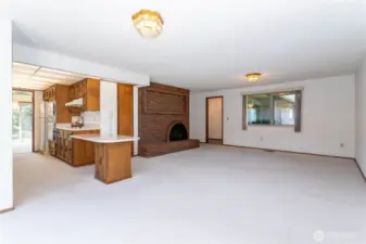Kitchen & family room with 2nd of two fireplaces