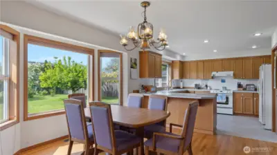 Large open kitchen with big bay window
