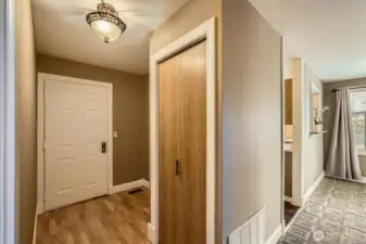 The front entry provides extra space for a table or bench and decorating.
