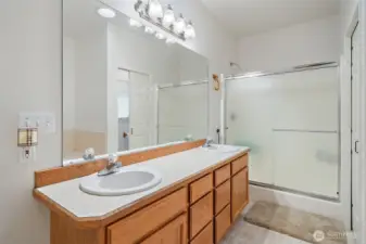 Dual Vanity's, soaking tub and a privy in the Primary