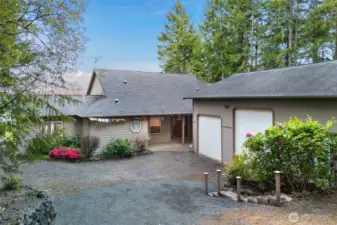 This lot is tucked away and private. There is extra parking to the right of the shop/garage.