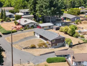 View of the home from the East. Property line is just behind to garden shed which nis at the Northwest corner of the property