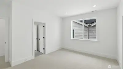 Each secondary bedroom continues the home’s bright, serene aesthetic, pairing clean architectural lines with soft textures and spacious closets — a thoughtful balance of comfort and design continuity.